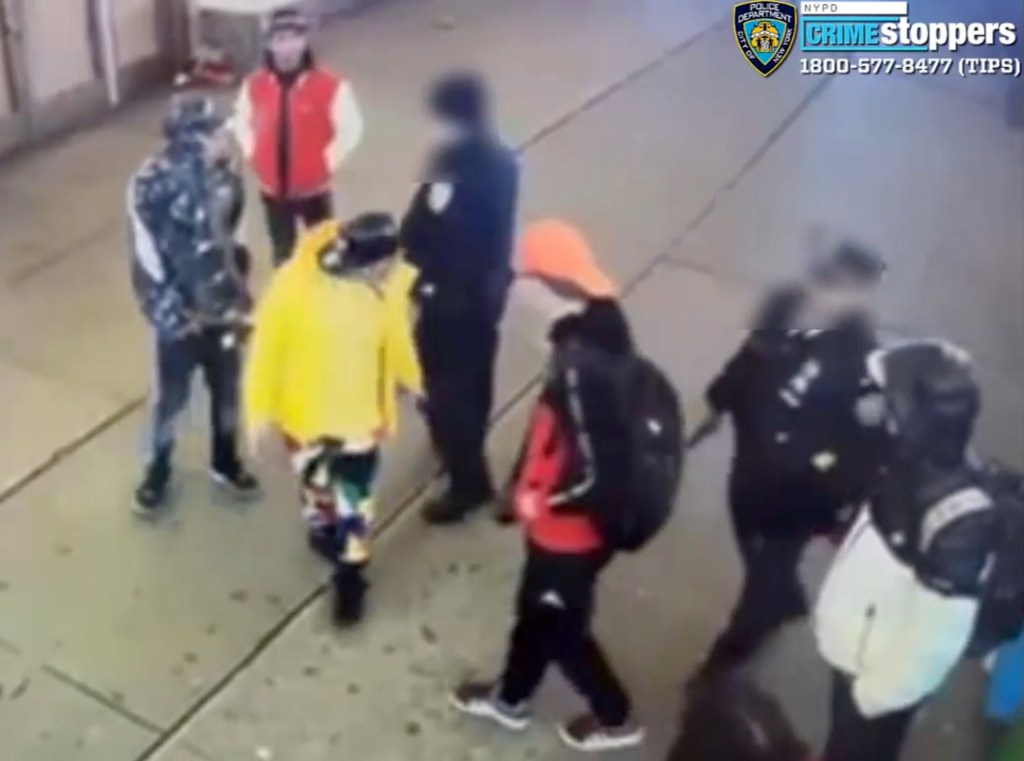 Cops confront migrants in Times Square.