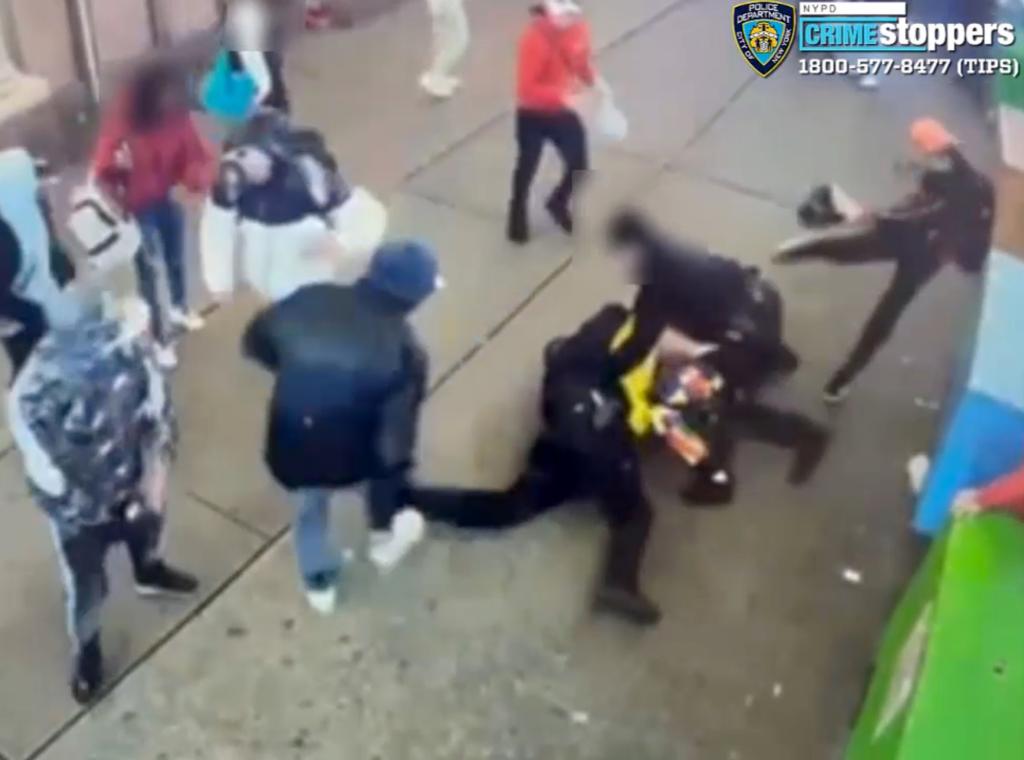 Migrants kicking cops in Times Square. 