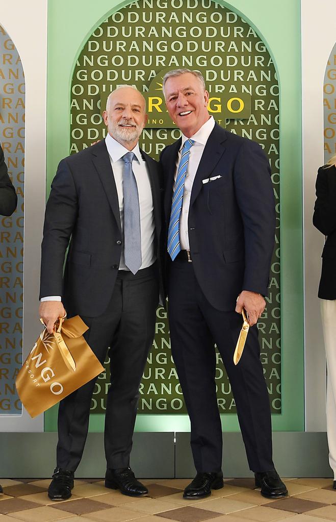 Frank Fertitta III and Lorenzo Fertitta in suits standing at Durango Casino & Resort ribbon cutting in Las Vegas, Nevada.