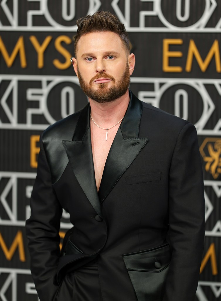 Bobby Berk at the 75th Emmy Awards Jan. 15 in LA, where he and Tan France embraced.