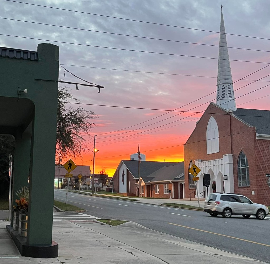 Downtown Brooksville, Florida with church and sunset sky