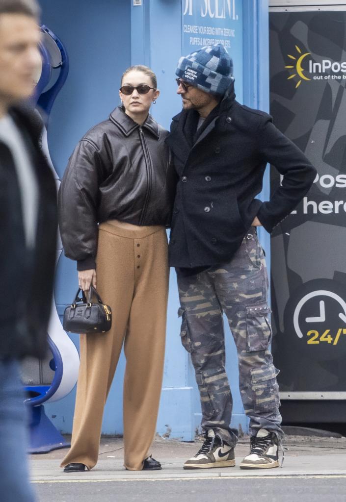 Gigi Hadid and Bradley Cooper are seen holding hands as they take a romantic stroll around London on Thursday afternoon.