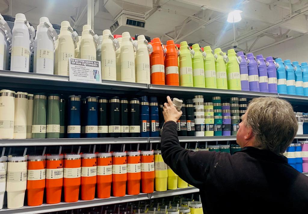 A man shops for Stanley cups and water drinking bottles from a fully-stocked supply at a sporting goods store in Pasadena, California, on January 24, 2024. Grand theft, customer stampedes and employees being fired for snaffling them: First the internet loved the Stanley Cup, and now the real world is going crazy for it. The insulated drinking cup, which comes in enough different colours to make a decorator blush, is the must-have accessory for people who want to be both stylish and well-hydrated. (Photo by Frederic J. BROWN / AFP) (Photo by FREDERIC J. BROWN/AFP via Getty Images)