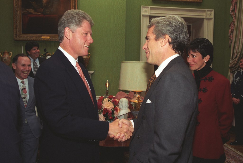 Jeffrey Epstein shakes hands with then President Clinton with Ghislaine Maxwell looking on.