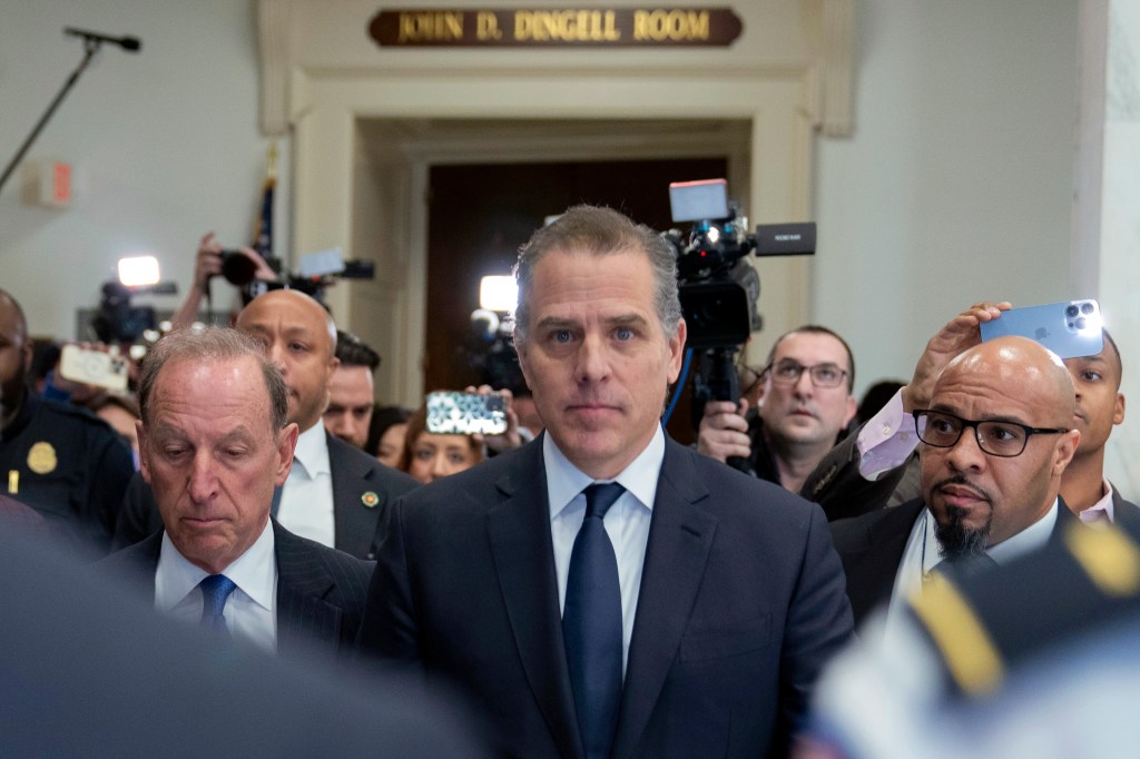 Hunter Biden, President Joe Biden's son, accompanied by his attorney Abbe Lowell, leaves a House Oversight Committee hearing as Republicans are taking the first step toward holding him in contempt of Congress, Wednesday, Jan. 10, 2024.