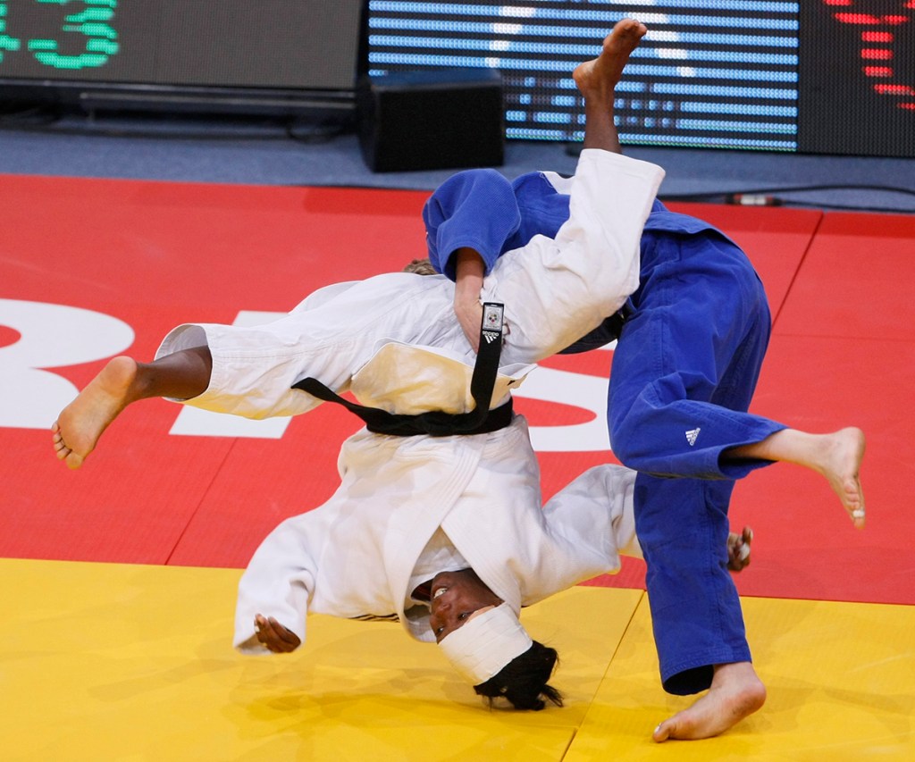 Maricet Espinosa of Cuba, white jersey, fights with Uska Zolnir of Slovenia, during their women's under 63 kg category third place match at the World Judo Championships in Paris Thursday, Aug. 25, 2011.  