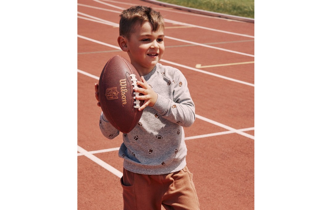 A boy holding a football