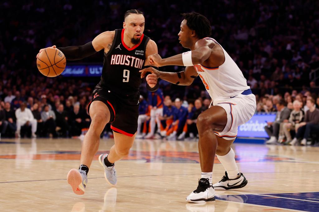 Dillon Brooks #9 of the Houston Rockets dribbles as OG Anunoby #8 of the New York Knicks defends during the second half at Madison Square Garden on January 17, 2024 in New York City. The Knicks won 109-94.