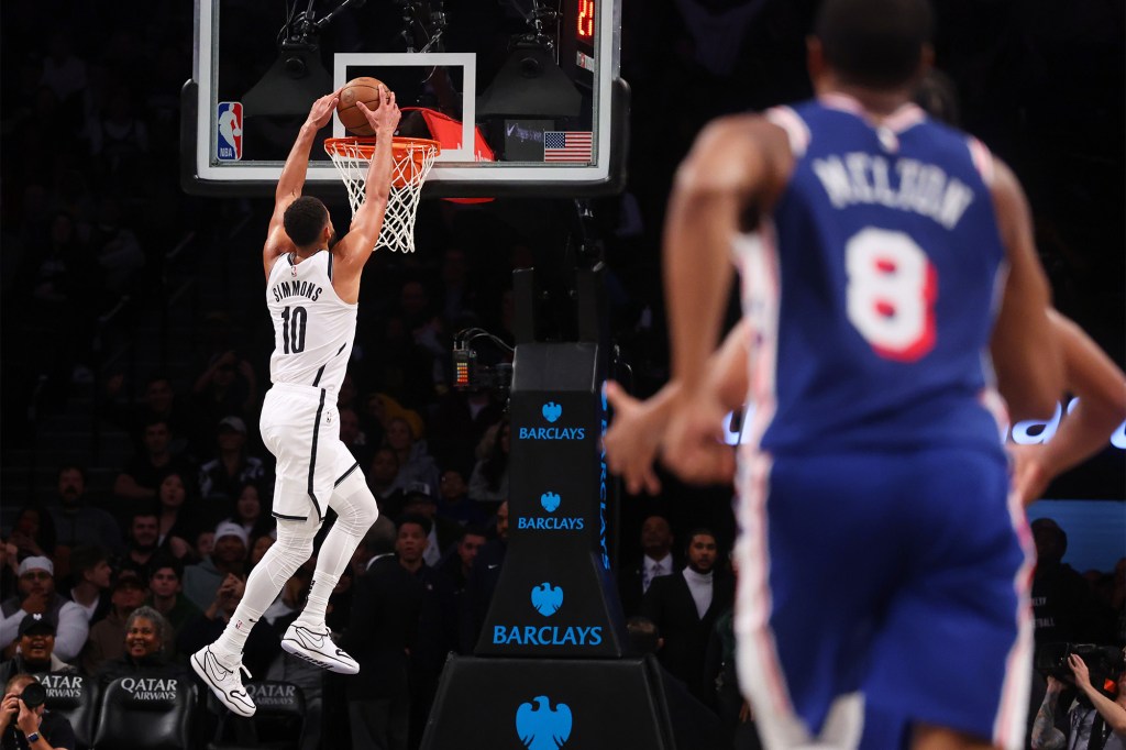 Ben Simmons dunks during the Nets' preseason loss to the 76ers.