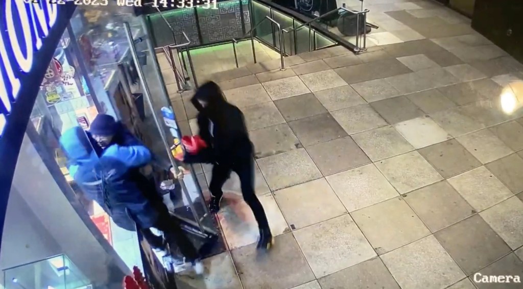 Video shows moment robbers force themselves past elderly worker into Queens jewelry shop in February of 2023.