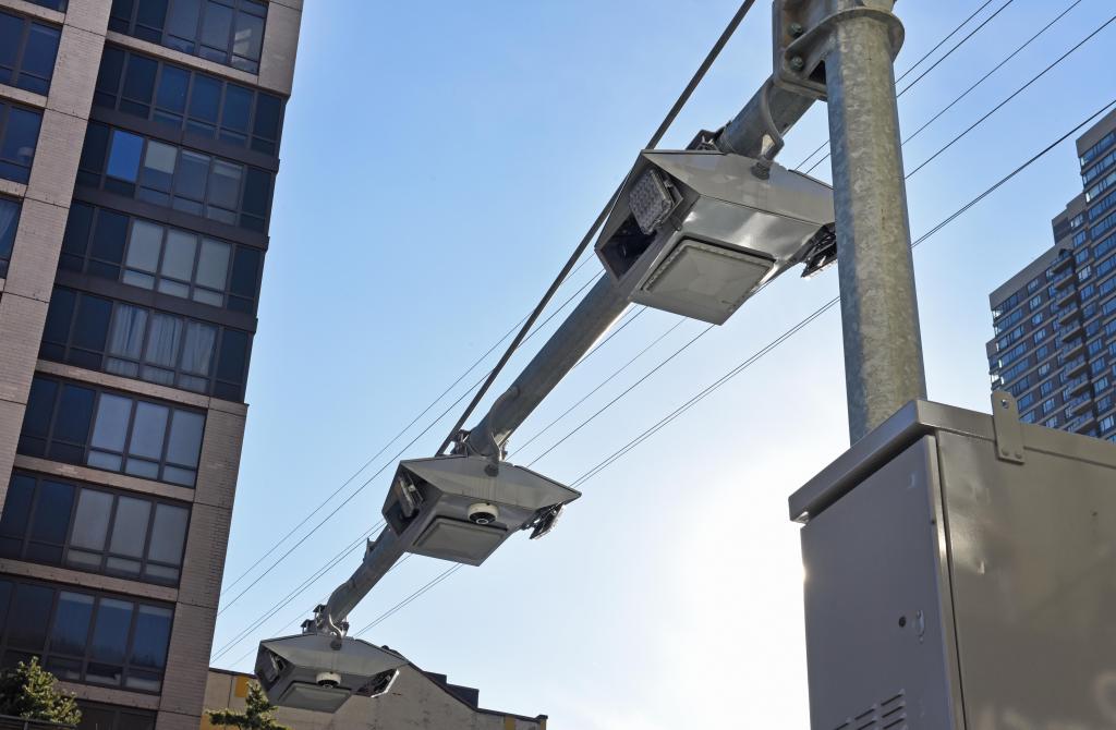 New camera/scanner boxes installed on First Ave near Roosevelt Island Tram to charge vehicles for NYC's congestion pricing plan. Photo by Gregory P. Mango.