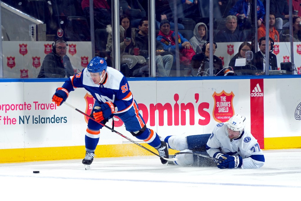 Casey Cizikas #53 of the New York Islanders is pursued by Victor Hedman #77 of the Tampa Bay Lightning during the third period at UBS Arena on February 24, 2024 in Elmont, New York.