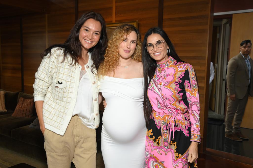 Rumer Willis (center) with her stepmother Emma Heming Wills (left) and her mom Demi Moore (right). 