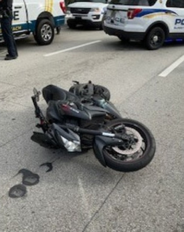 Motorcycle lying on the road following Gil's arrest in Sunny Isles on Saturday.