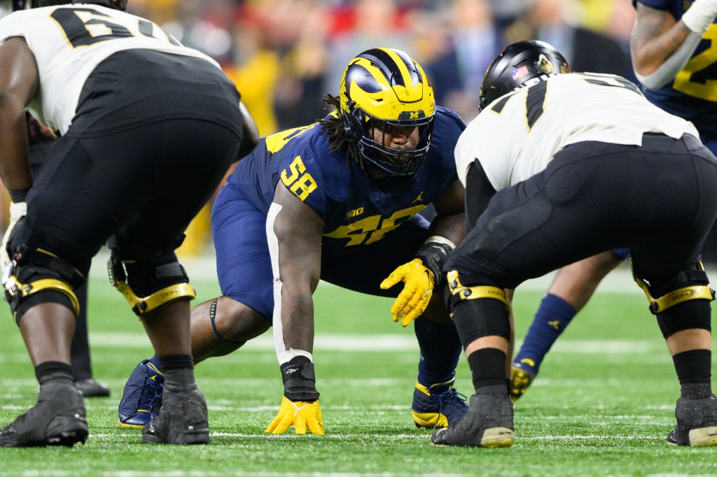 Michigan Wolverines defensive lineman Mazi Smith (58) lines up