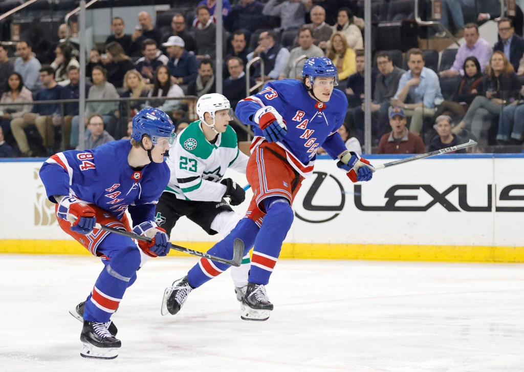 Rangers center Matt Rempe skates down ice