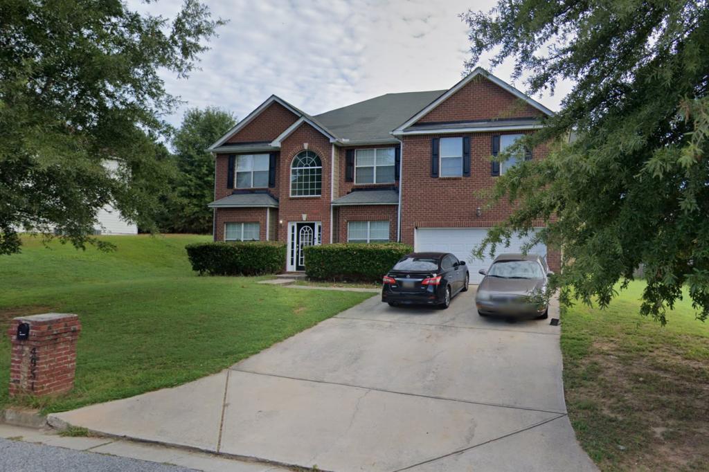 The property at 4951 Wewatta Street in South Fulton, Atlanta - where four squatters were said to have run an illegal strip club.