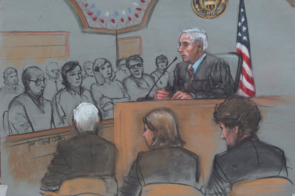 A sketch artist rendition of the scene inside the John J Moakley Federal Courthouse of Dzhokhar Tsarnaev (right) along with his defense team Judy Clarke and David Bruck and Judge George O'Toole (center) during the the first day of sentencing of Tsarnaev's trial in Boston on April 21, 2015.