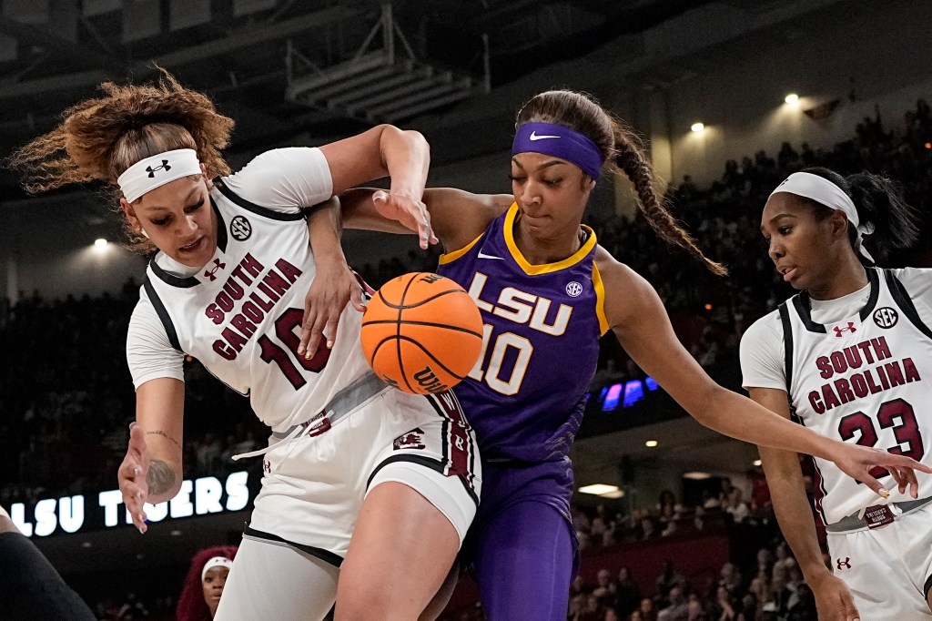 South Carolina's Kamilla Cardoso (l.) and LSU's Angel Reese (r.) battle for the ball in the SEC Championship game on March 10, 2024.