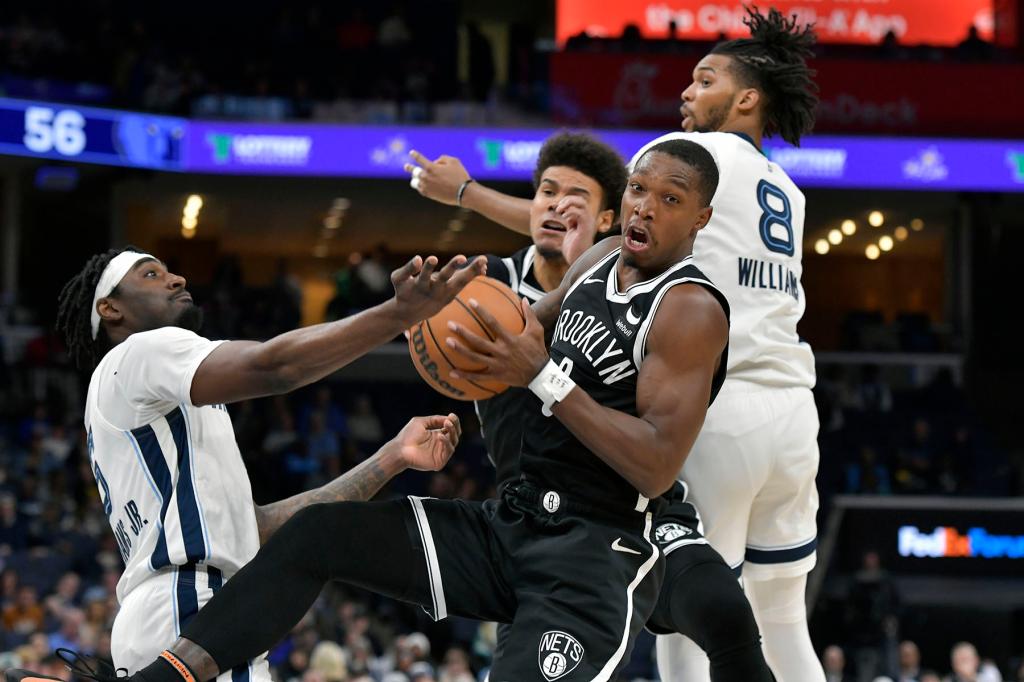 Brooklyn Nets guard Lonnie Walker IV, front right, controls the ball between Memphis Grizzlies guard Vince Williams Jr., left, and forward Ziaire Williams (8) in the second half of an NBA basketball game Monday, Feb. 26, 2024, in Memphis, Tenn. (AP Photo/Brandon Dill)Lonnie Walker IV,Vince Williams Jr.,Ziaire Williams