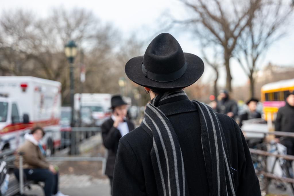 Group of Hasidic men and boys outside Chabad-Lubavitch headquarters in Brooklyn, where a secret tunnel was recently discovered.