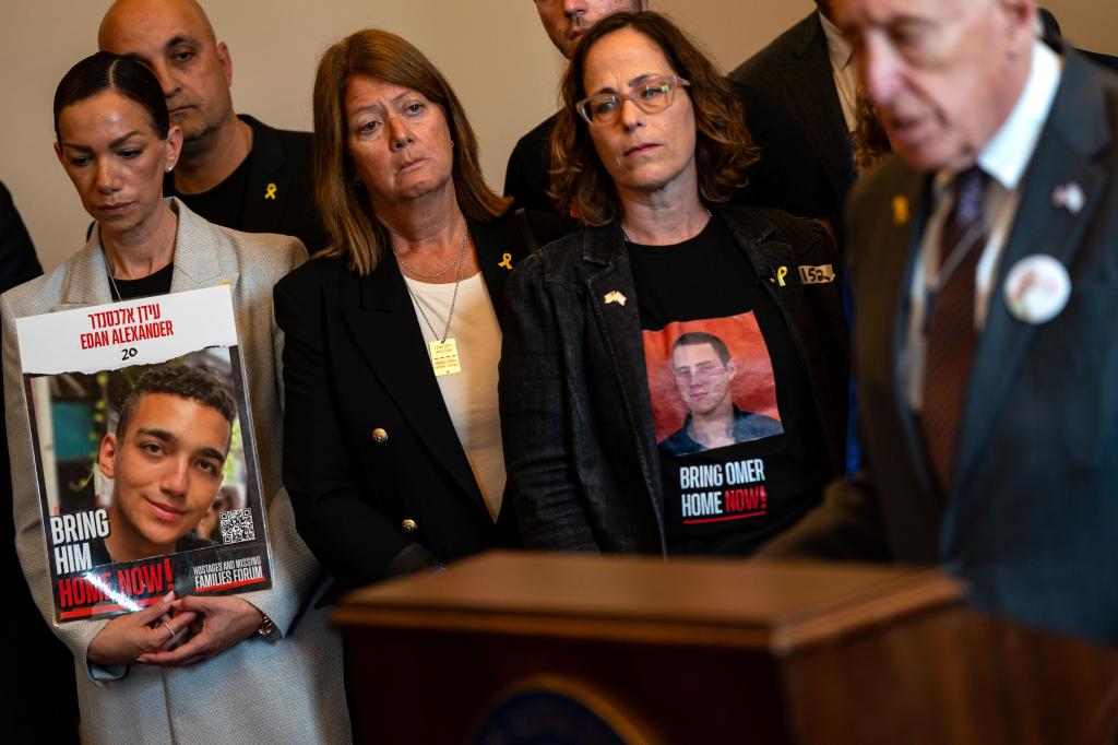 Yael Alexander, left, and Orna Neutra, center, attend a news conference in Washington last month about the efforts to free their sons.