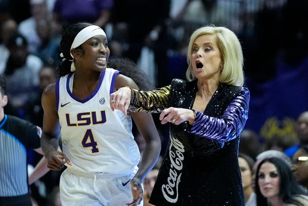 LSU head coach Kim Mulkey calls out from the bench as guard Flau'jae Johnson (4) runs up court in the first half an NCAA college basketball game against South Carolina in Baton Rouge, La., Thursday, Jan. 25, 2024. 