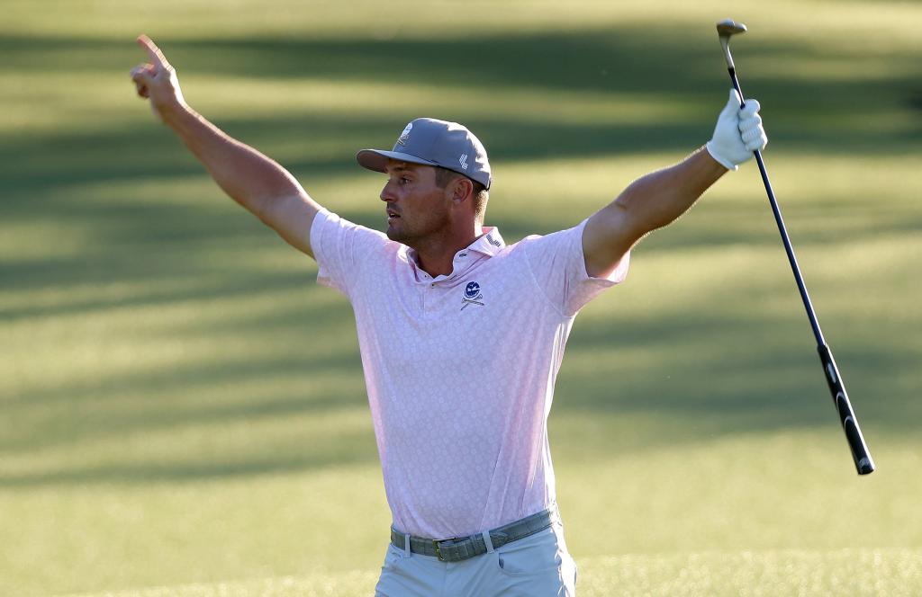 Bryson Dechambeau celebrates after making a long hole out for birdie on the 18th hole during the third round of the Masters.