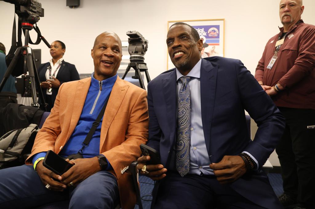 Darryl Strawberry (l.) shares a moment with Doc Gooden (r.) at a press conference before his number retirement ceremony.