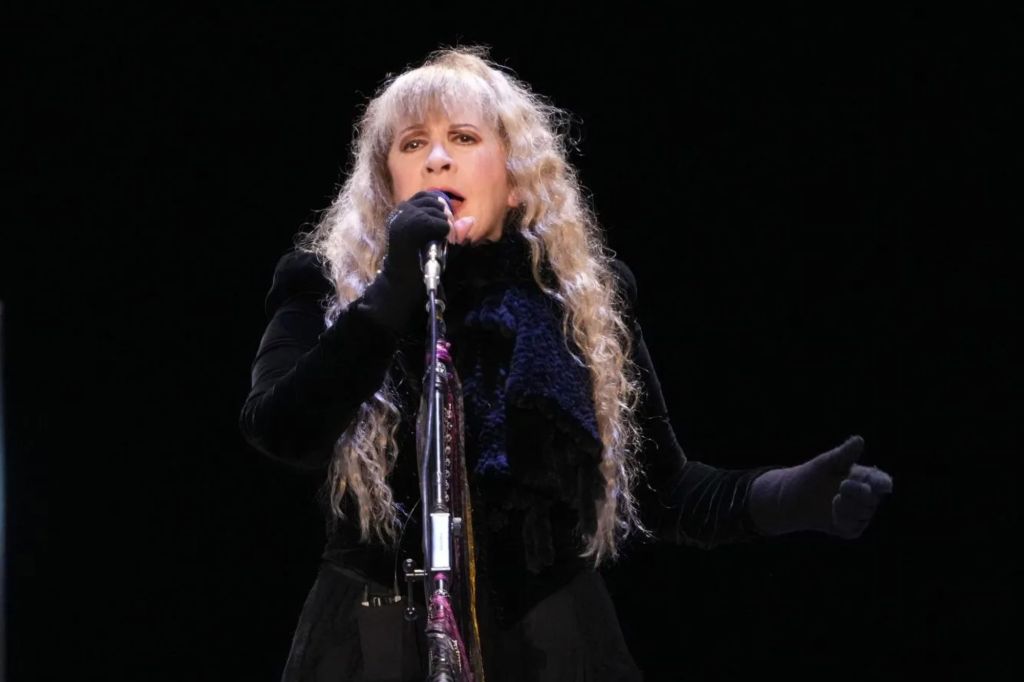 Stevie Nicks singing into a microphone, collaborating with Taylor Swift on her new album