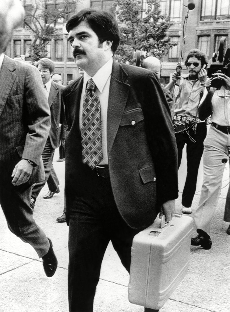 A Secret Service agent carries additional Watergate tapes in 1974.