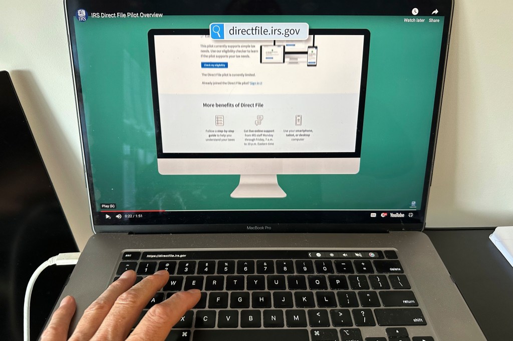 A person navigating the Internal Revenue Service website on a laptop in New York, April 1, 2024, symbolizing tax-related identity theft issues.