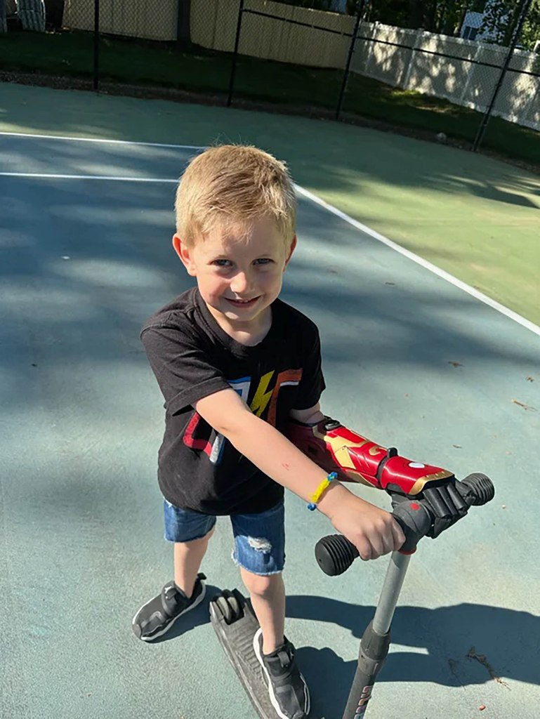 Jordan was most excited to take his scooter for a ride with two hands.