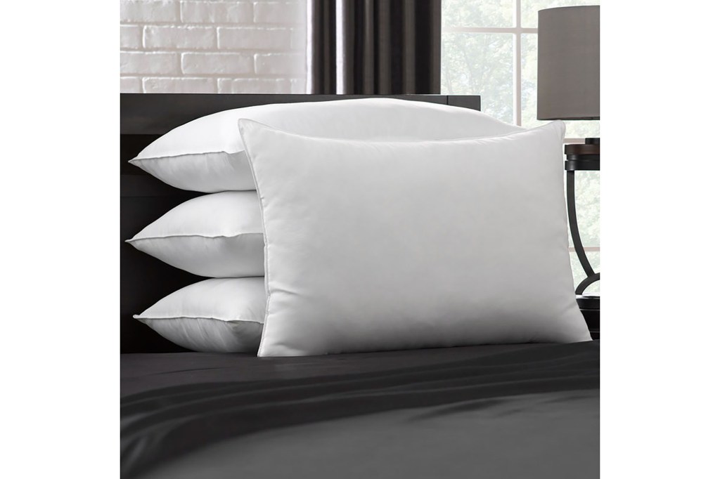 A group of pillows on a bed