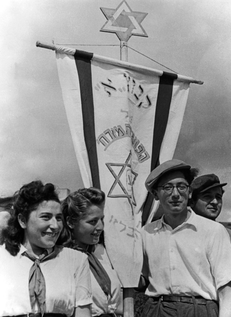 At the the former Nazi concentration camp, at Belsen, young Jews,