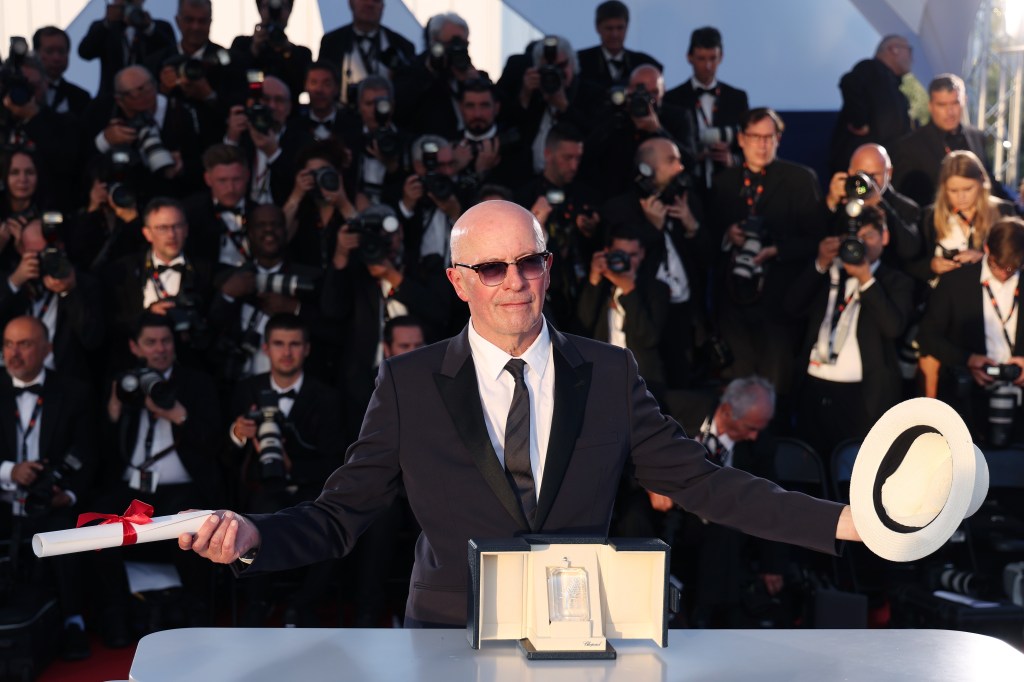 Jacques Audiard poses with the 'Jury Prize' Award for “Emilia Perez.”
