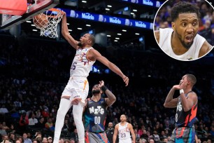 Kevin Durant of the Suns dunks against the Nets; the Cavaliers' Donovan Mitchell
