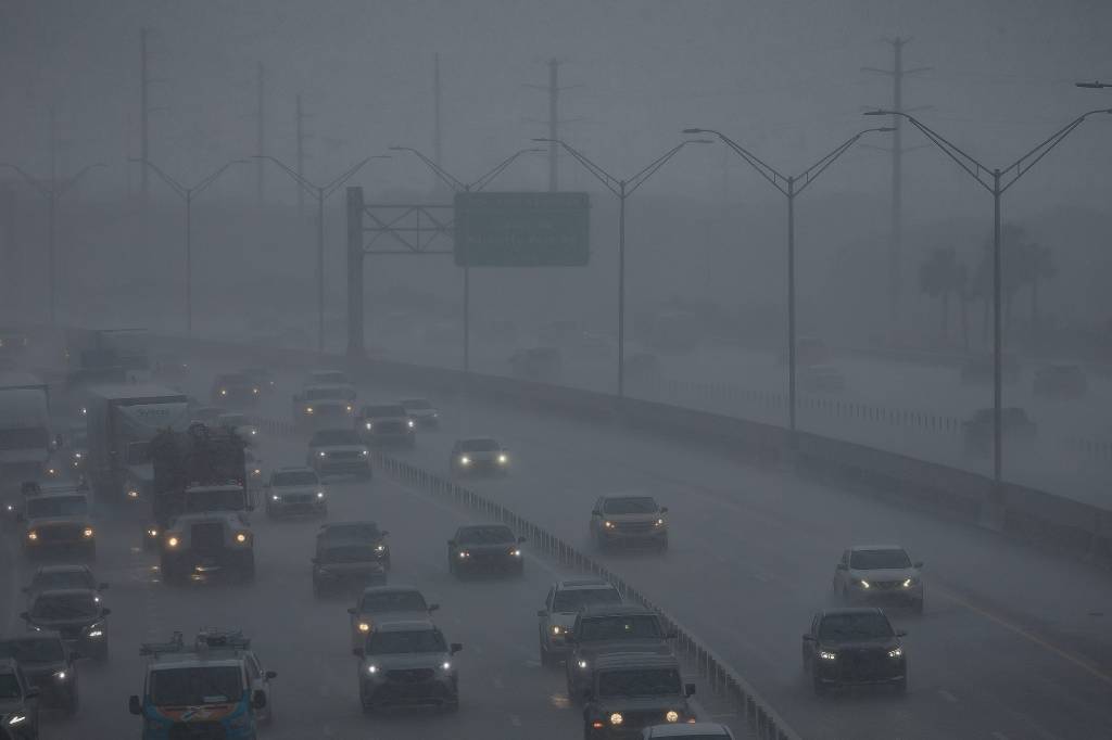 Motorists navigating through heavy rain and traffic on the northbound Interstate 95 in Boca Raton, Florida on June 14, 2024.