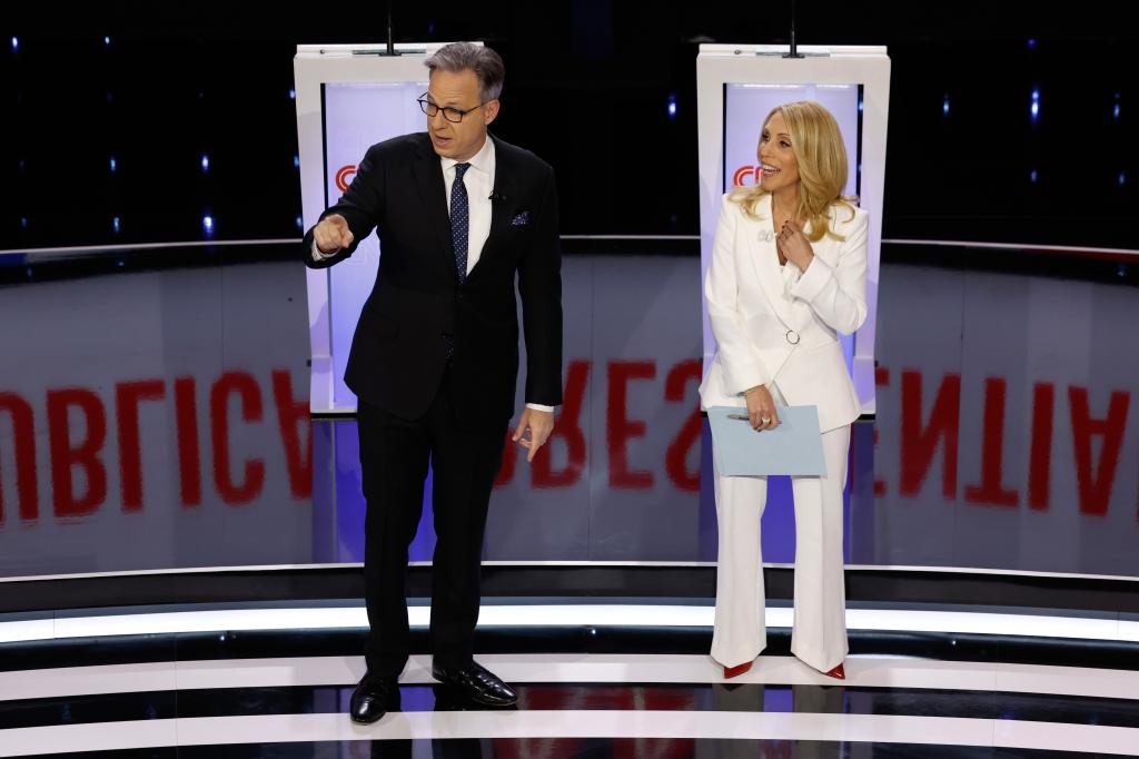 Moderators and CNN hosts Jake Tapper and Dana Bash speak to the audience before the start of the CNN Republican Presidential Primary Debate in Sheslow Auditorium at Drake University on January 10, 2024 in Des Moines, Iowa. 