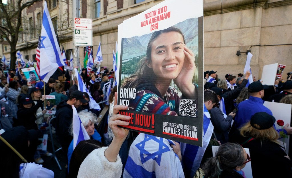 People participate in the "Bring Them Home Now" rally, calling for the release of Israeli hostages kidnapped by Hamas on October 7, 2023, outside of Columbia University on April 26, 2024, in New York City