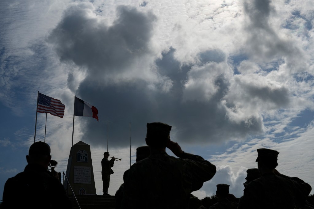 Members of the U.S. joint military service academy choir take part in a ceremony at Utah Beach near Sainte-Marie-du-Mont, Normandy, France, Wednesday, June 5, 2024. World War II veterans from across the United States as well as Britain and Canada are in Normandy this week to mark 80 years since the D-Day landings that helped lead to Hitler's defeat.