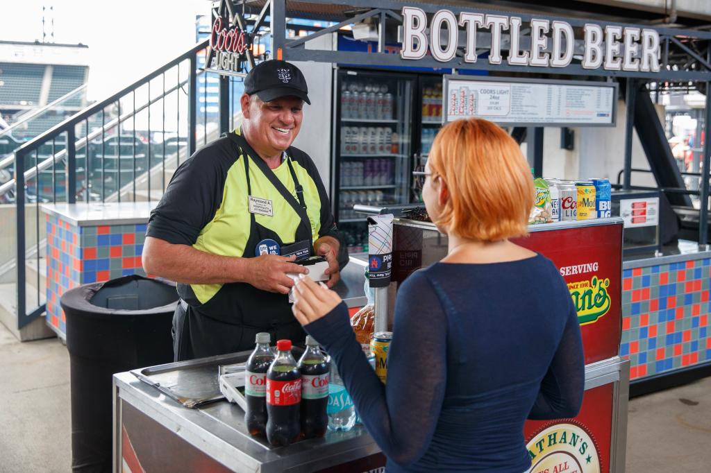 50 year veteran Raymond Acceta serving hot dogs, beer along with other drinks and snacks at Citi Field during a Mets home game against the Los Angeles Dodgers.