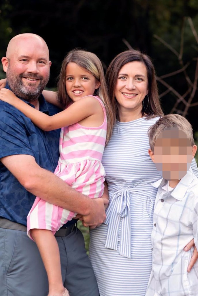 A young family, husband, wife, little girl (Sydney Weston), and little boy with his face blurred out.