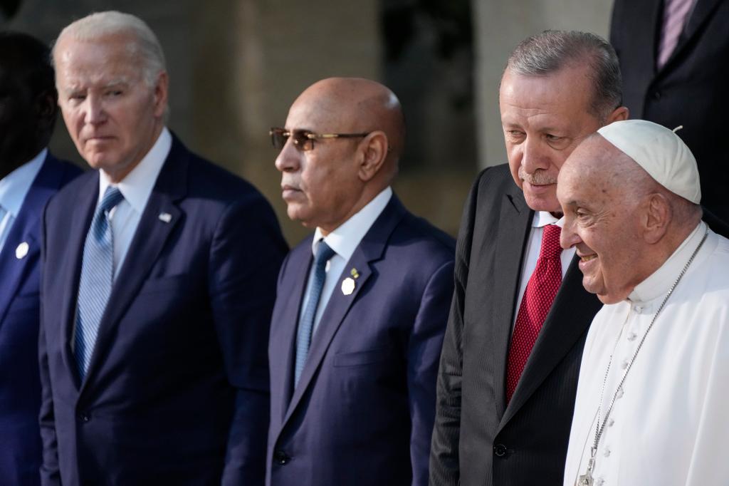 From left, Joe Biden, Mauritania President and African Union Chairperson Mohamed Ould Ghazouani, and Turkey's President Recep Tayyip Erdogan pose for a family photo with Pope Francis, right, at the G7 summit, Friday, June 14, 2024, in Borgo Egnazia, near Bari, southern Italy