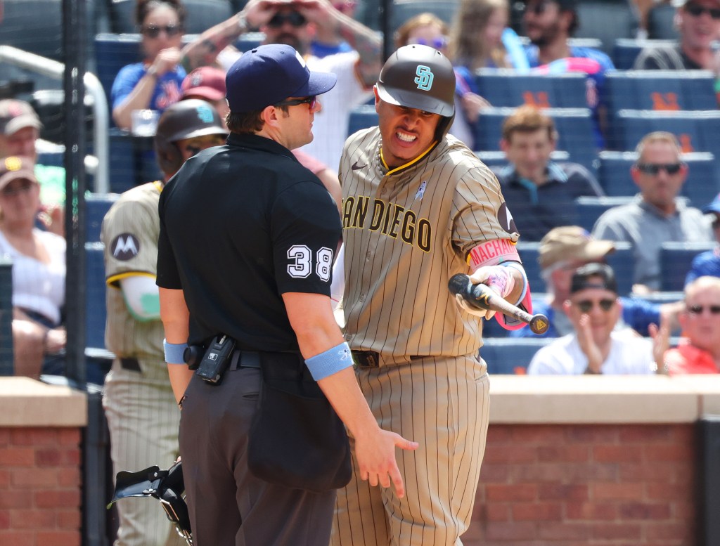 Padres star Manny Machado gives home plate umpire Adam Beck a piece of his mind Sunday. Machado was ejected from the game.