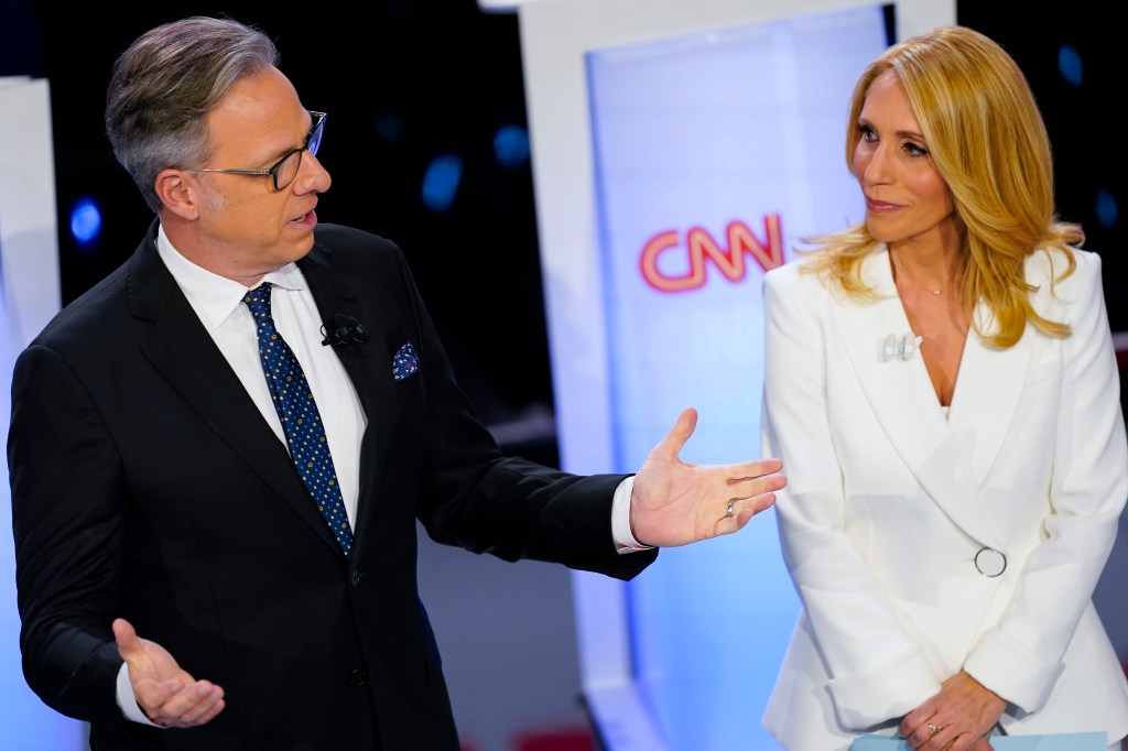 CNN anchors Jake Tapper, left, and Dana Bash, right, speaking to members of the audience before the start of the CNN Republican presidential debate in Des Moines, Iowa, Wednesday, Jan. 10, 2024.