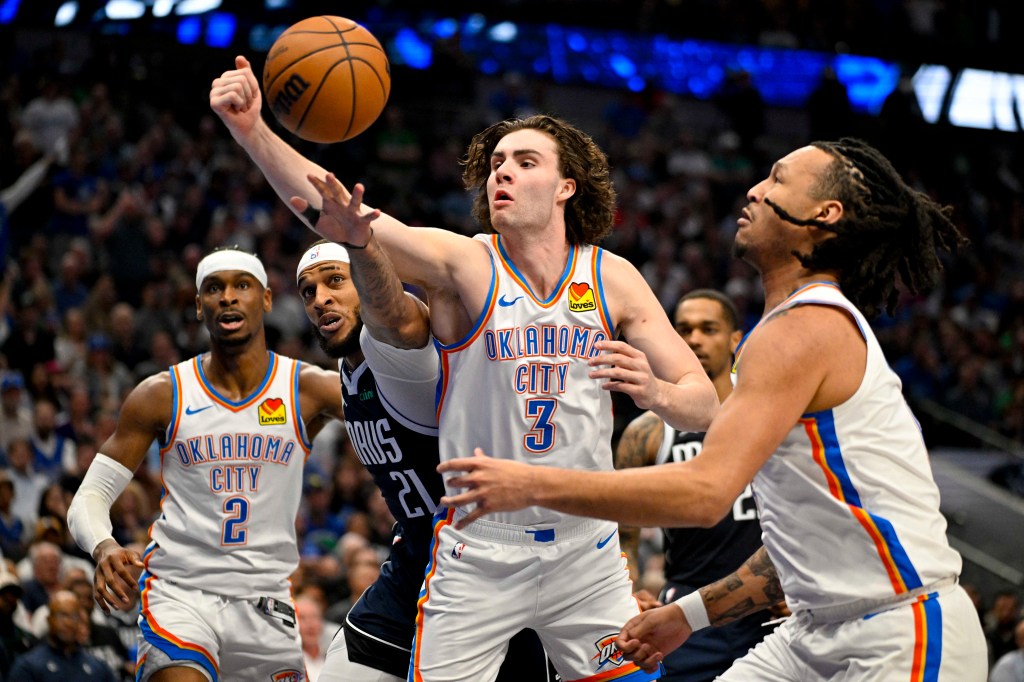 Dallas Mavericks center Daniel Gafford and Oklahoma City Thunder guard Josh Giddey battling for the rebound during the 2024 NBA playoffs game