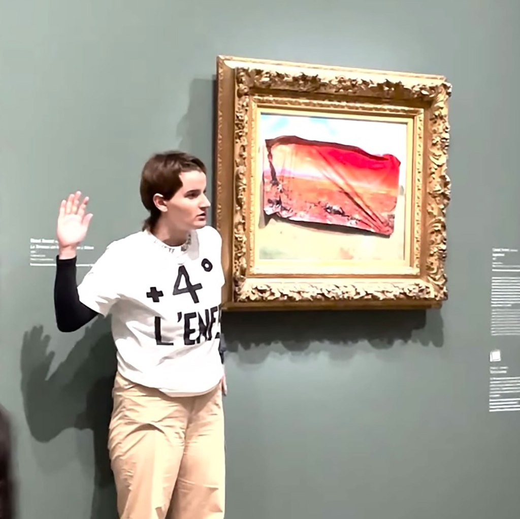 Environmental activist placing sticker depicting a ravaged 'Poppy Field' on Claude Monet's original painting in the Musée d'Orsay