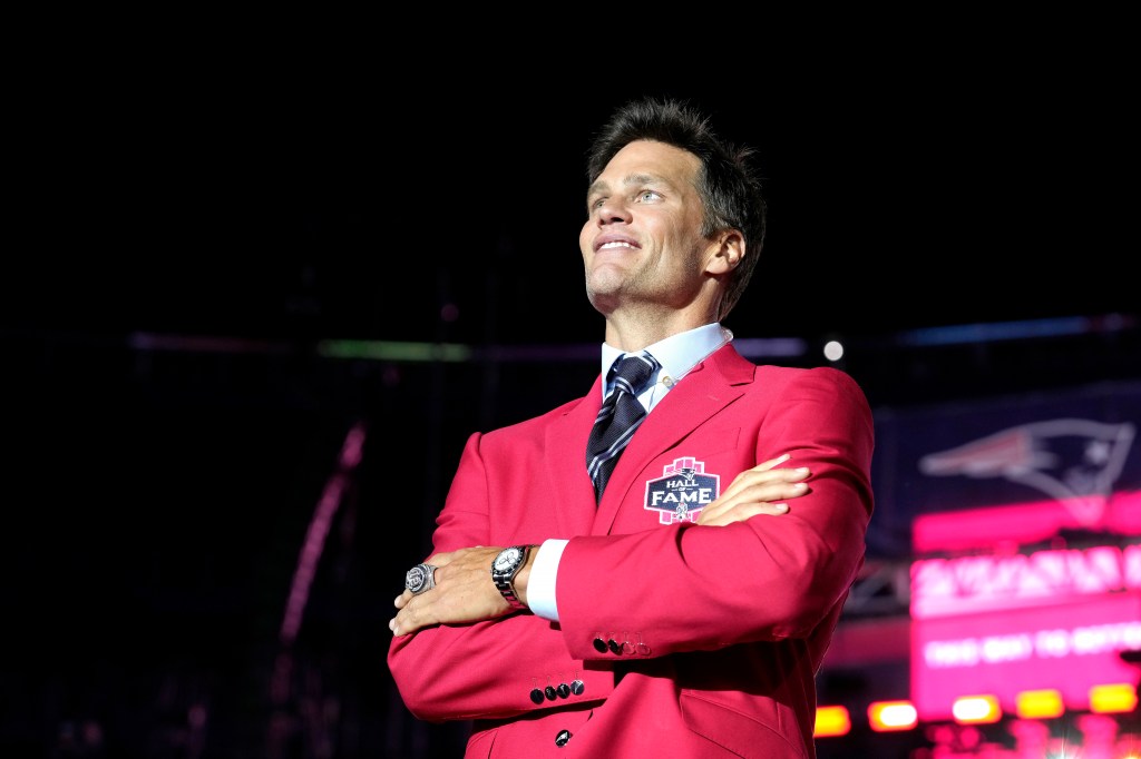  New England Patriots quarterback Tom Brady looks into the crowd at the conclusion of Patriots Hall of Fame induction ceremonies for Brady at Gillette Stadium.