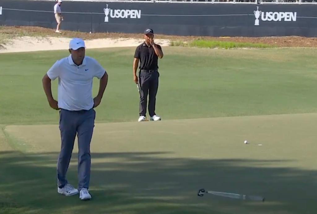 Scottie Scheffler, the world's top-ranked golfer, flipping his putter into the air in frustration on the Pinehurst No. 2 greens at the U.S. Open.